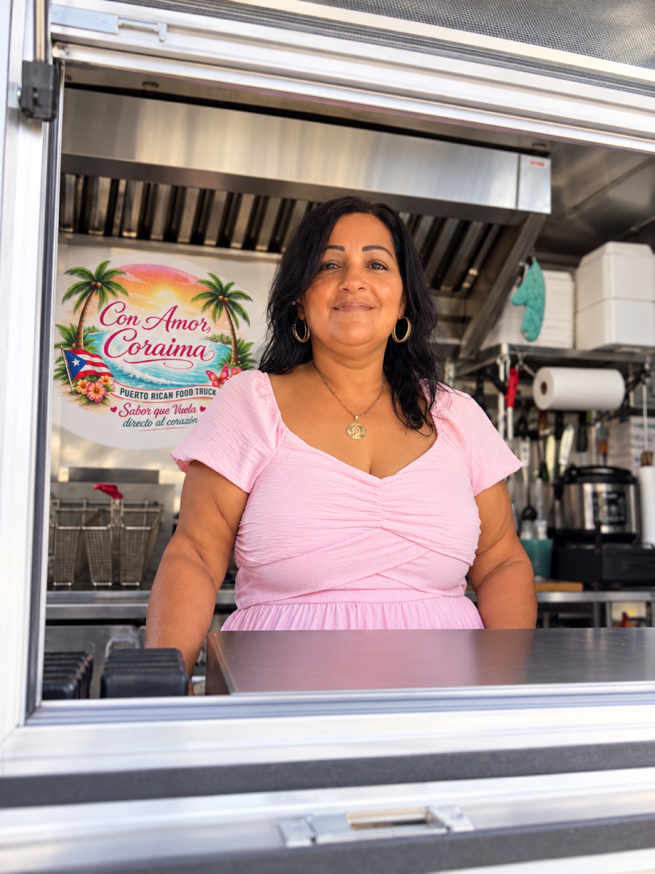 Betty Otero serving customers from the Con Amor, Coraima food truck window